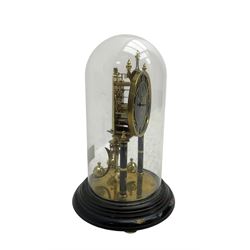 Kundo 1960’s torsion clock with a skeleton movement and four ball oscillating pendulum, with a glass dome. Torsion spring intact.