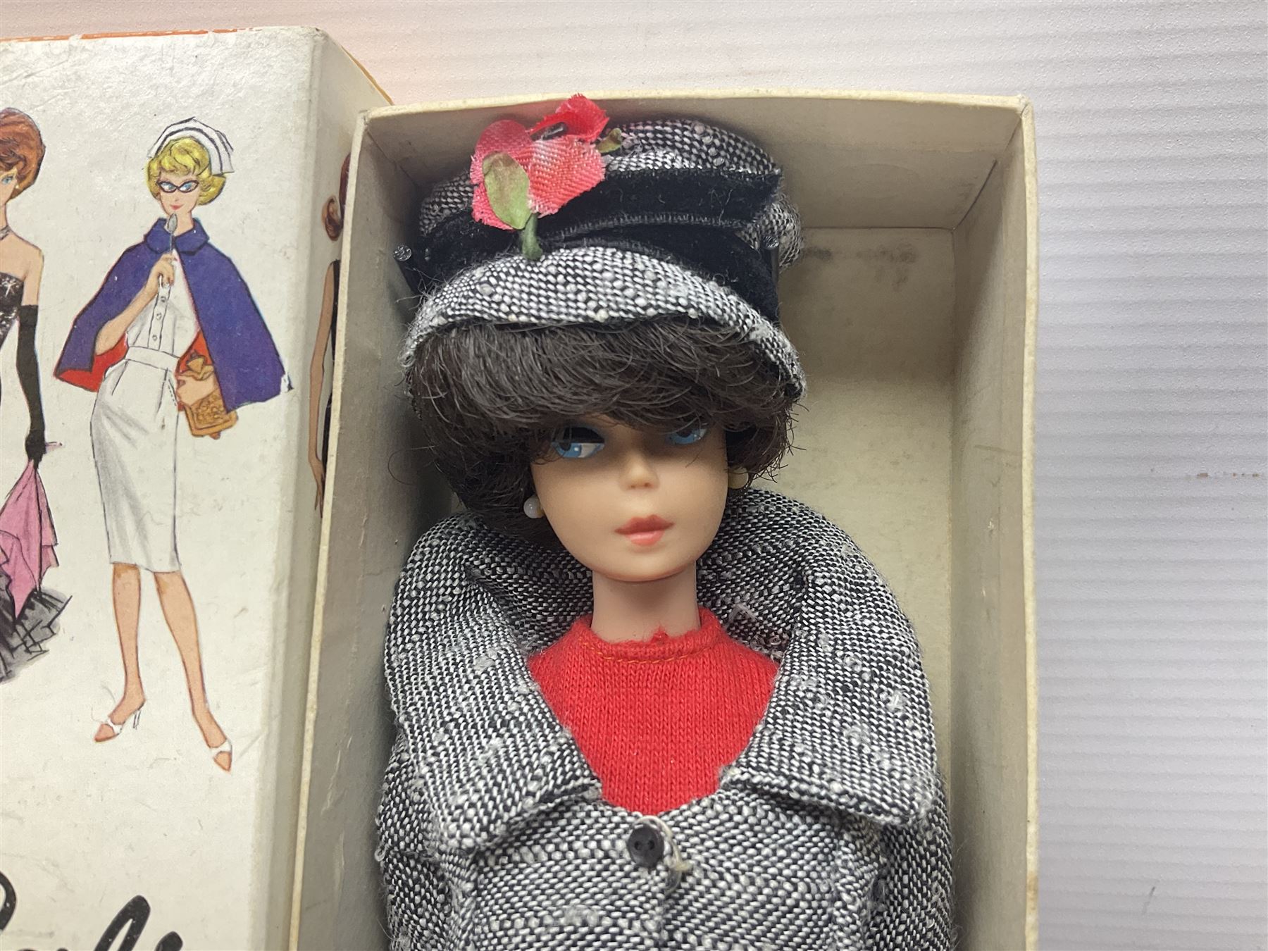 Two 1960s Mattel Barbie fashion dolls - 'Ski Queen' and 'Career Girl'; each in original decorative box with paperwork; and a quantity of Mattel and other fashion doll clothing