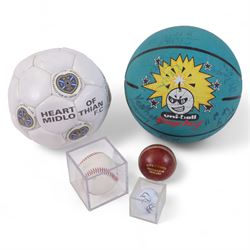 Four signed balls, including golf ball, signed at 2002 British open by Bernard Langer, Uni...