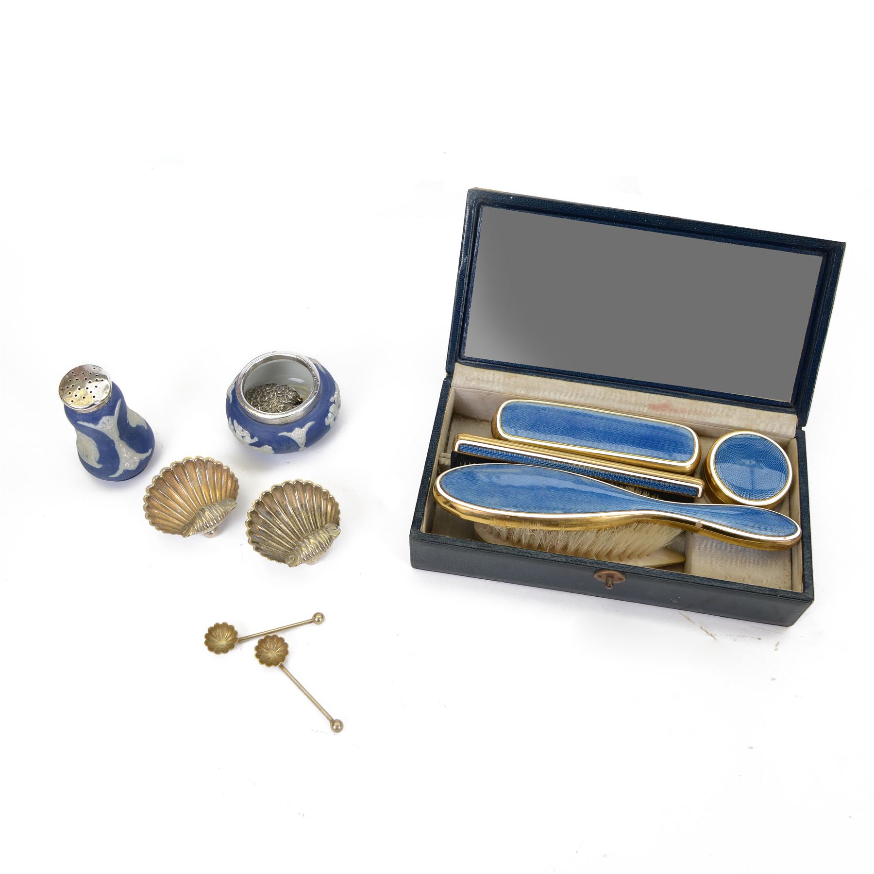 Blue guilloche enamel decorated travel dressing table set, housed in a blue carry case, together with a pair of silver plated shell salts with matching spoons, Wedgwood Jasperware salt with silver top, hallmarked and other cabinet items 