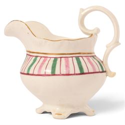 Late 19th century tea service, decorated with a green and pink strips, with internal decoration of budding branch within a gilt band upon a white glazed ground, comprising  twin handle lidded sucrier, milk jug, three serving plates, nine cups and saucers and four teacups