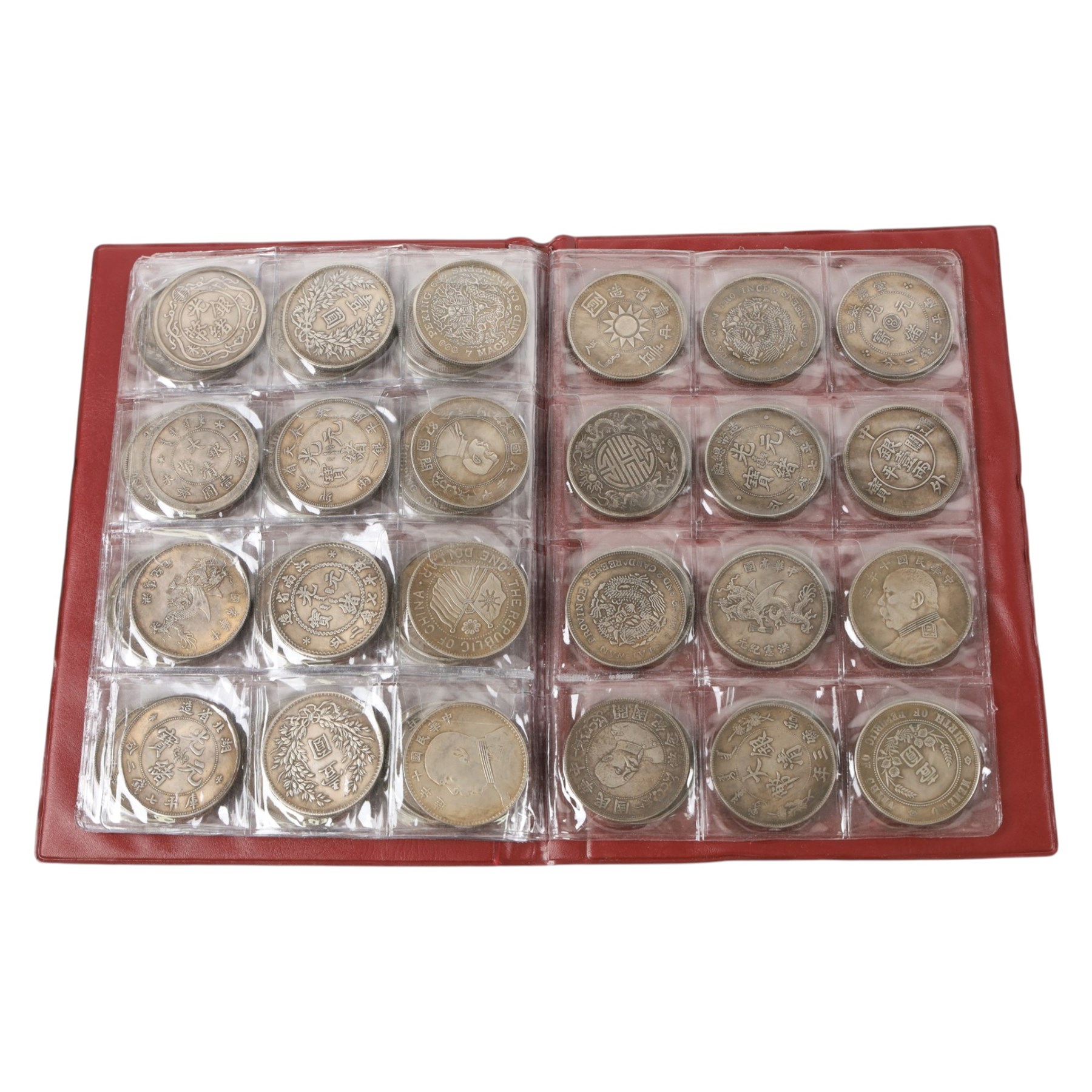 Seventy-two restrike Chinese coins, in a red album