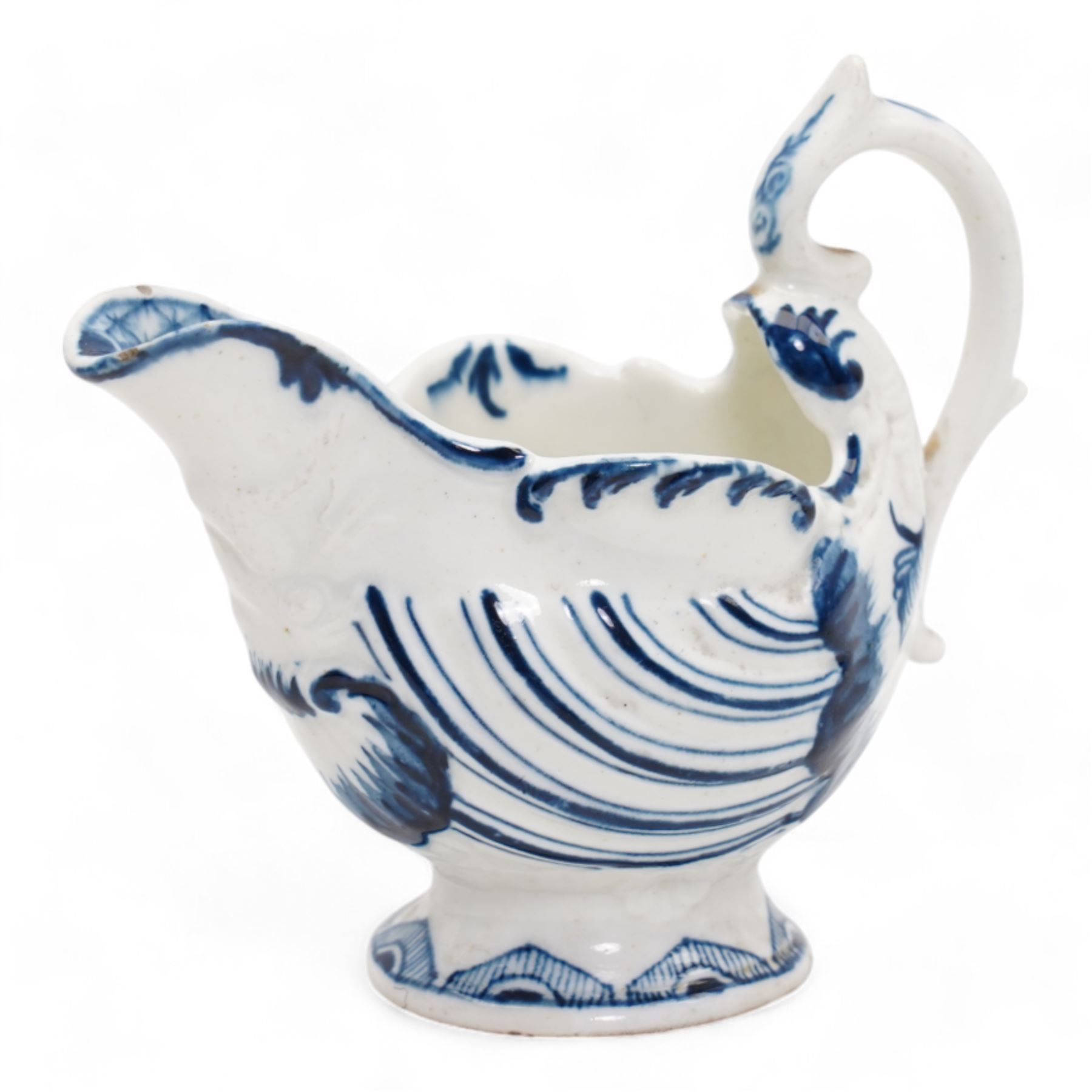 18th century Derby blue butter boat, circa 1770, of helmet form, moulded with shells and dolphin lip, on pedestal foot, H8.5cm x L9.5cm 