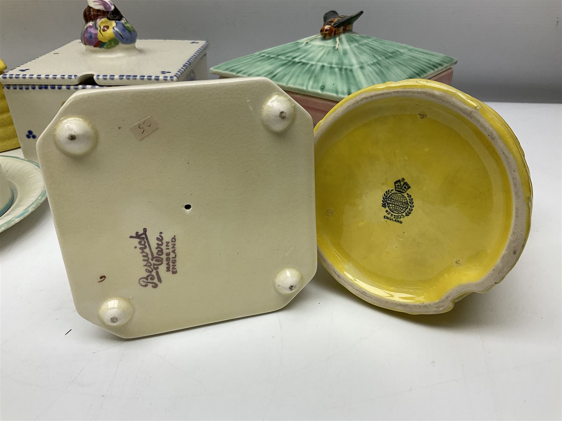 Clarice Cliff for Wilkinson Ltd Crocus Bizarre beehive honeypot painted in the Crocus pattern, together with two beehive Beswick honey pots, Poole square honey pot etc (14)