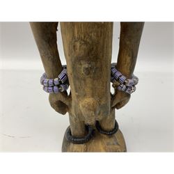 Early 20th century West African Yoruba family wooden figure of Orisha Oko, the god of farming/agriculture, carved from the solid, bears manuscript label of provenance verso H26.5cm