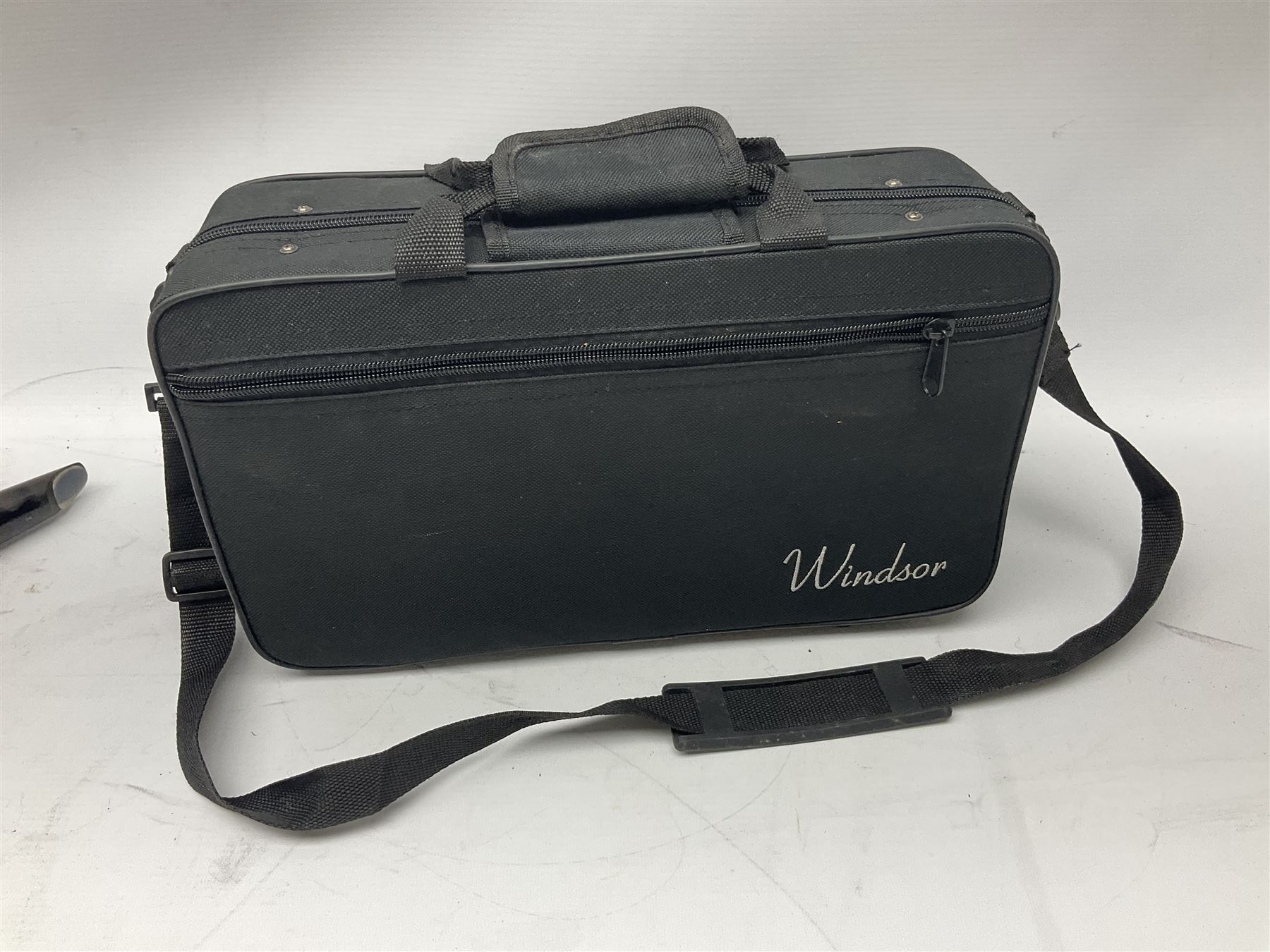 Windsor five-piece clarinet, serial no.EK05580; and Selmer Console clarinet with B&H mouth-piece; both cased (2)