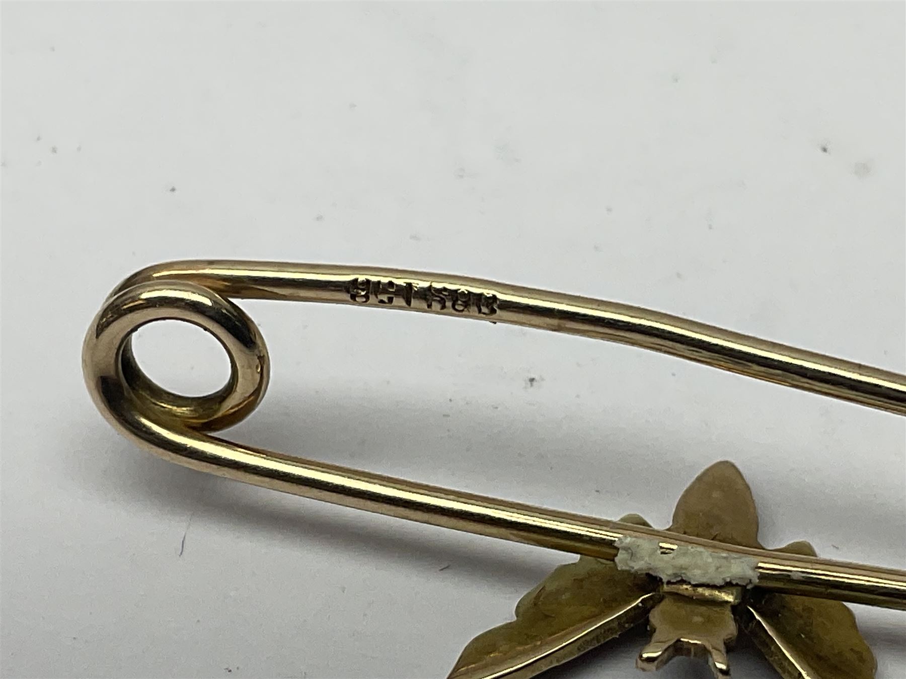 9ct gold pear butterfly brooch, 9ct gold stone set ring and an silver fob watch, all stamped or hallmarked 