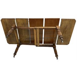 Late Victorian oak telescopic extending dining table, rectangular moulded top with canted corners, three additional leaves, on turned and reeded supports with brass and ceramic castors