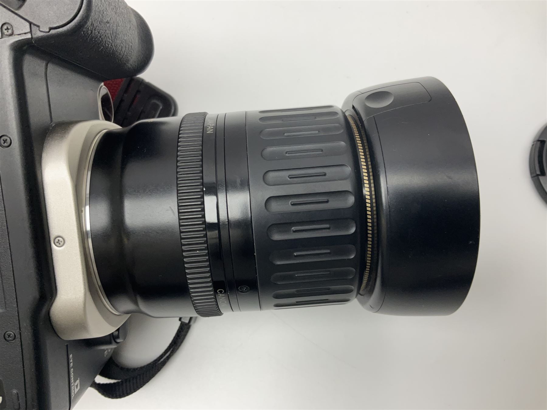 Canon EOS 50e camera body, serial no 8305671 with 'Canon Zoom EF 35-135mm 1:4-5.6' lens together with Halina 35X super camera body, with 'Halina Anastigmat f.c. 1:3.5 f=45mm' lens and other camera equipment 