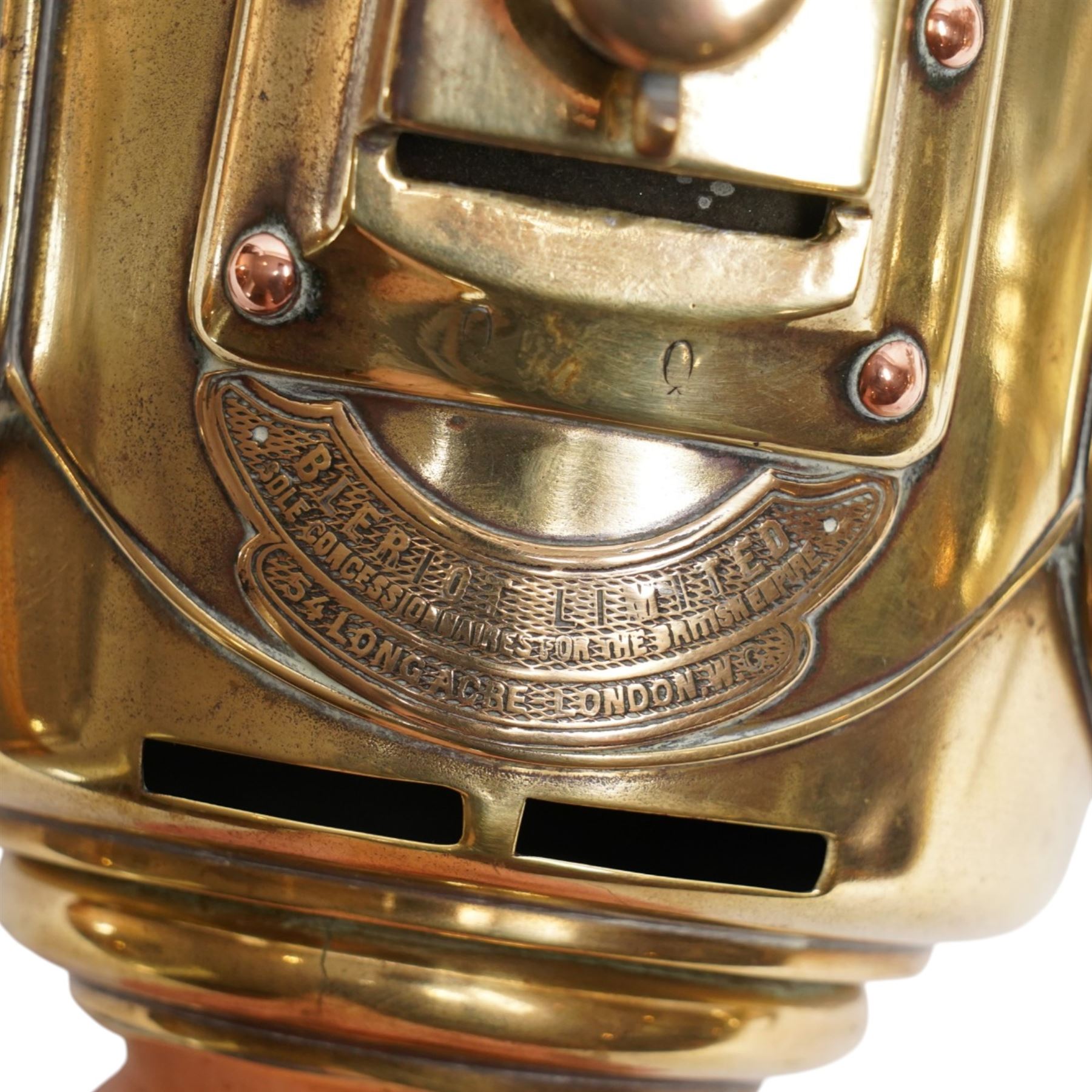 Bleriot Ltd. (London) - pair of Edwardian brass carriage lamps no.152, the body with three faceted bevelled glass panels, surmounted by brass chimney, the back mount with makers plaque below

