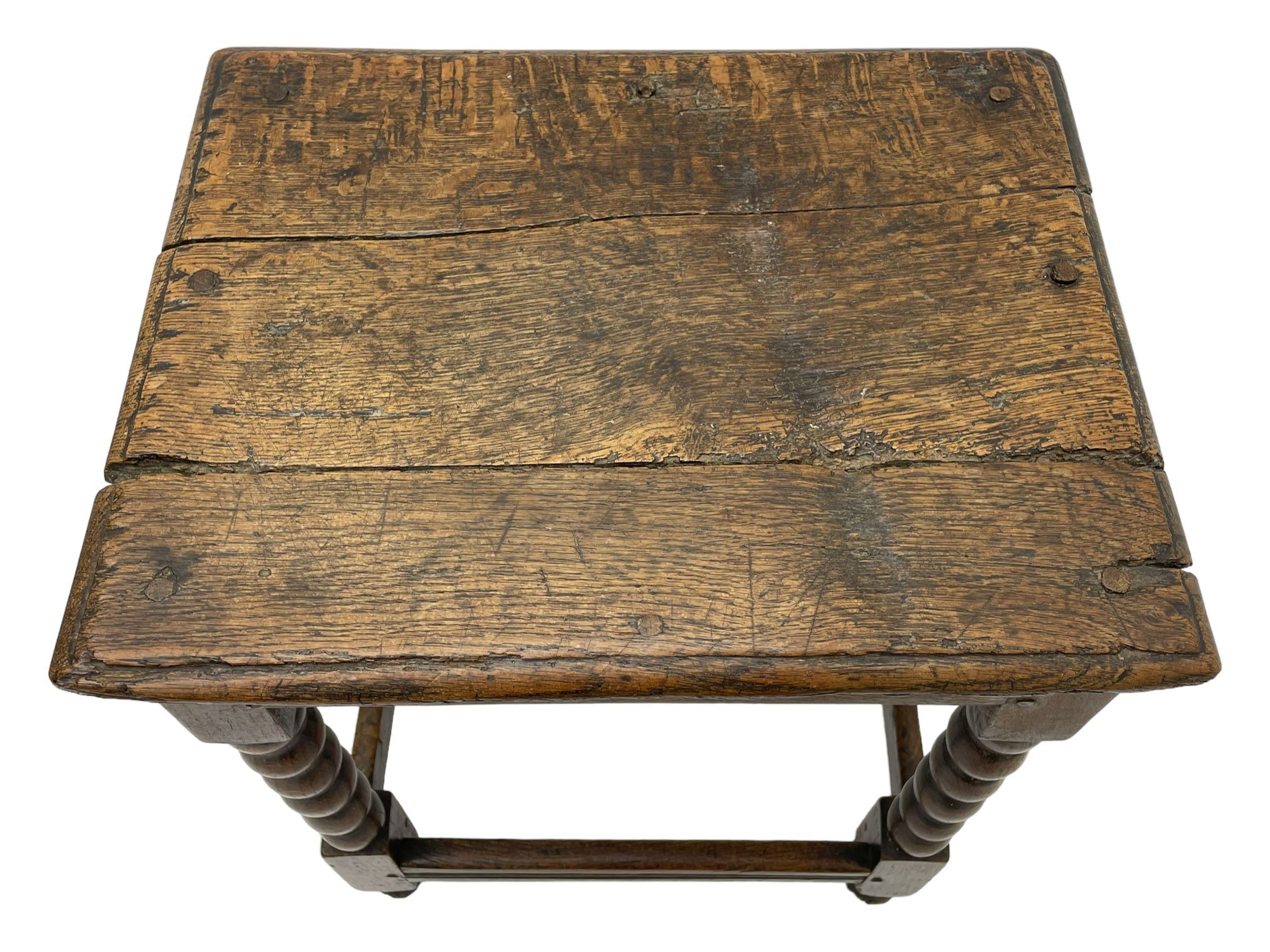 18th century oak joint coffin stool, moulded rectangular top over moulded frieze rails, raised on bobbin turned supports joined by moulded stretchers