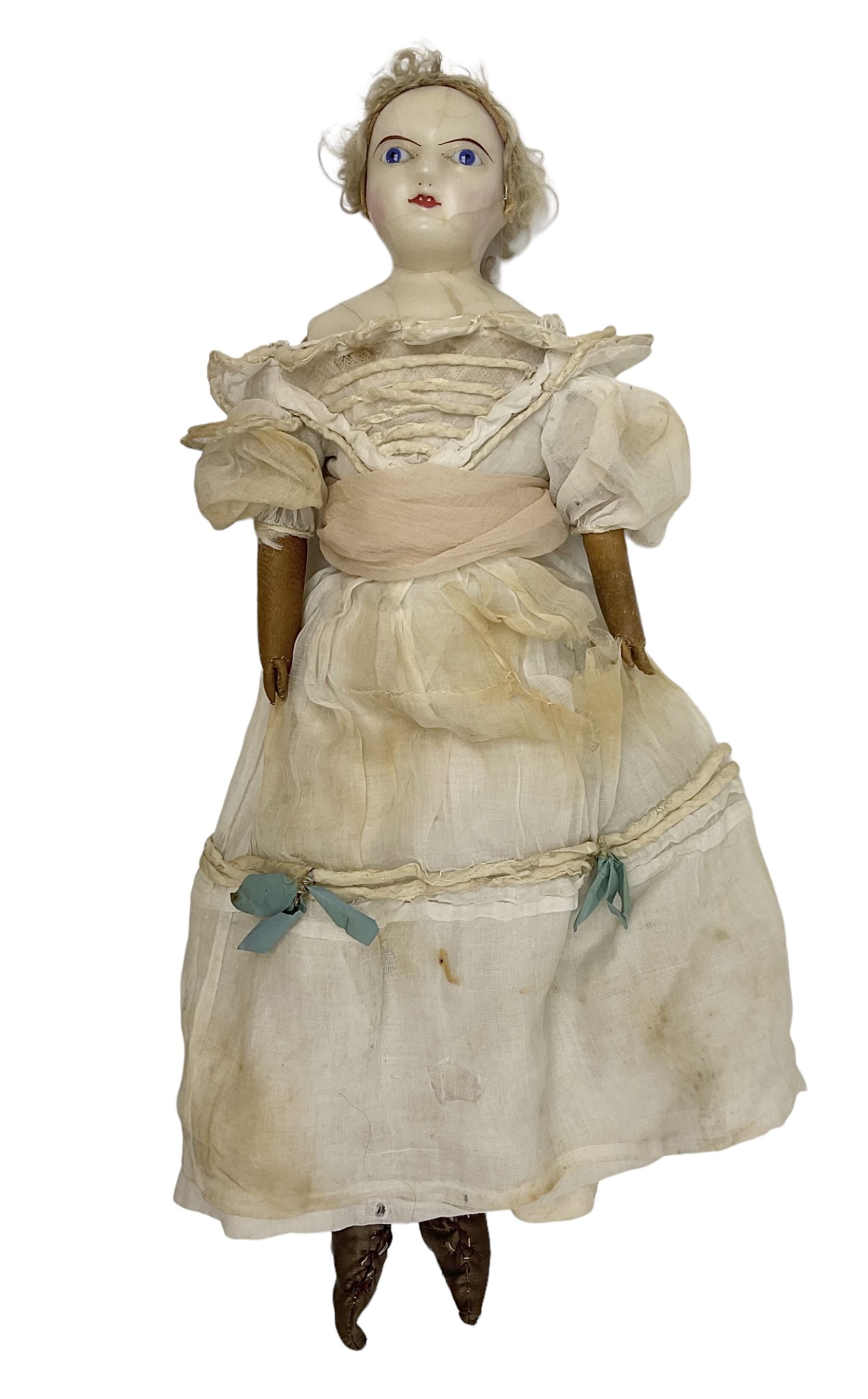 Victorian wax shoulder head doll with pale complexion, applied hair, inset glass eyes and fabric covered jointed body with kid leather lower arms; white linen dress and undergarments H50cm