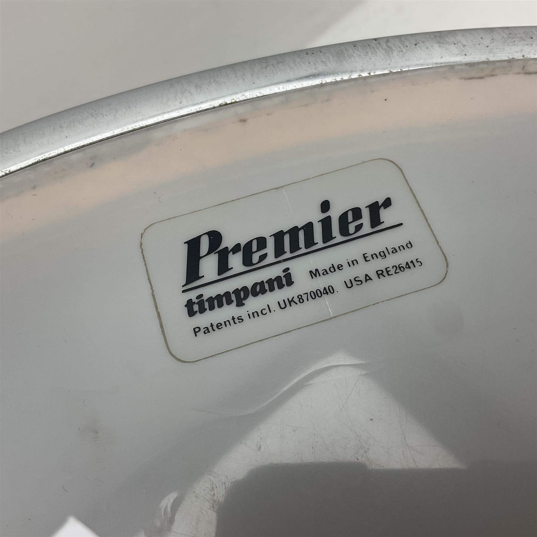 Timpani drum with coppered finish to the bowl, marked 'BS 3499' underneath, three adjustable tubular legs and Premier head D67cm