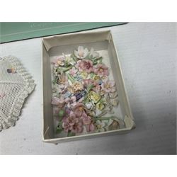 Seven Lladro flowers, comprising Japanese Camelia on base no 5181, Yellow Begonia on base no 5186, Miniature Begonia on base no 5188, Chrysanthemum on base no 5189, California Poppy no 5190.B, Miniature Begonia 5188.B and White Carnation no 5184.B, together with Lladro Spanish Joining pack with 17616 Winter Bell, Additional Lladro parasols and flowers etc 