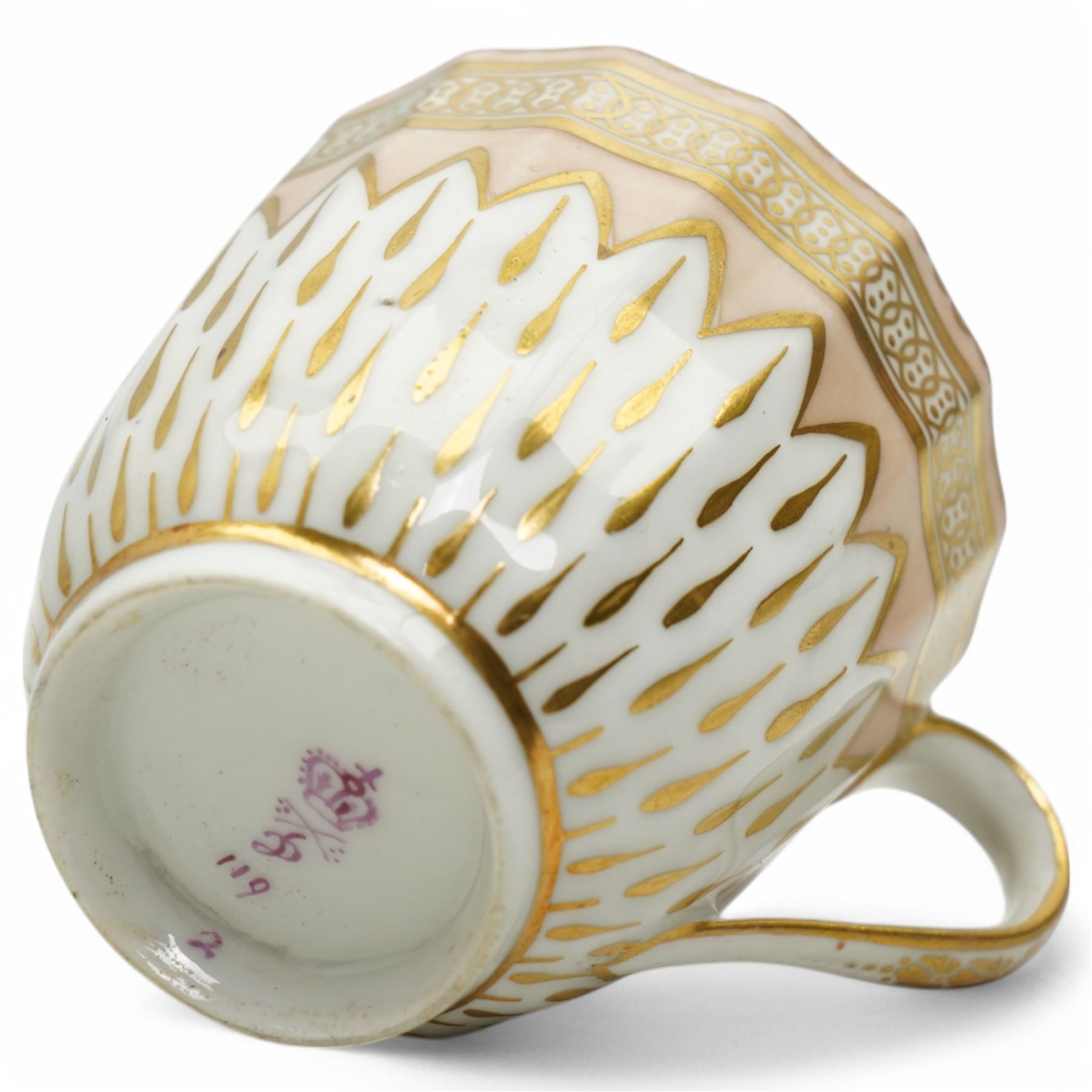 Derby coffee cup and large saucer, pattern 119, c.1795, the apricot ground decorated with gilt teardrop motifs and intricate Vandyke boarder, with crown, D mark and crossed batons in puce to base, decorator's mark no. 2 for Joseph Stables