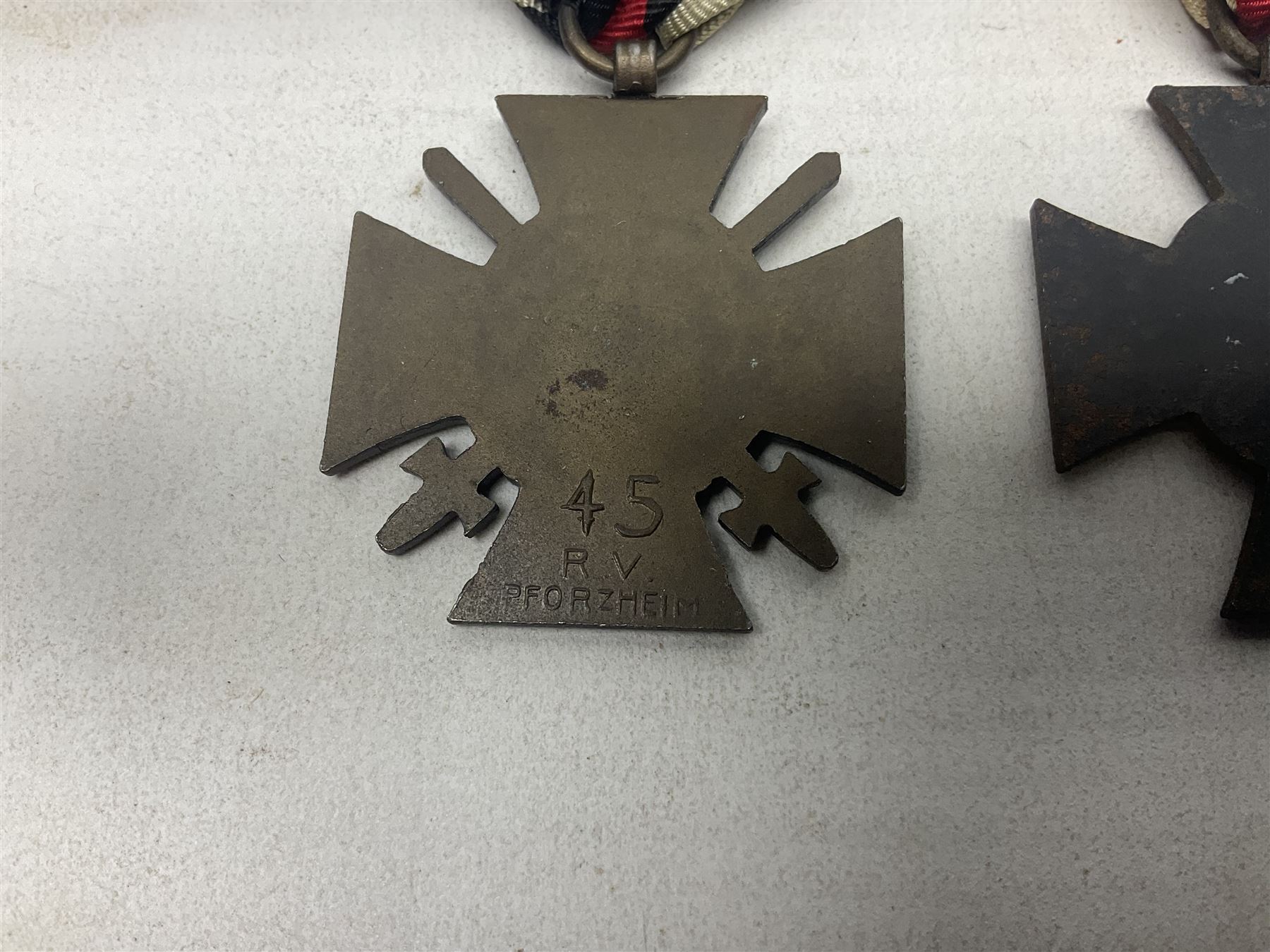 Two WW1 German medals - copy Cross of Honour with swords (combatants); Cross of Honour without swords (non-combatants); and two WW2 German medals - War Merit Medal; and War Merit Cross; all with ribbons (4)