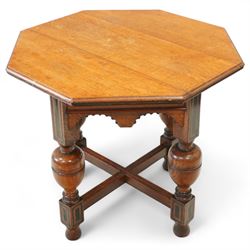 Late Victorian oak centre table, octagonal moulded top over a carved Gothic arched frieze,...