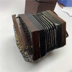 19th century rosewood concertina of hexagonal form with fretworked ends, twenty-one numbered bone keys and leather straps to each end, no visible maker's marks, W18cm, in original mahogany box with brass carrying handle  