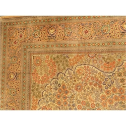  Persian multicoloured Tree of Life pattern silk rug,  the ivory field with a profuse flower filled vase, within repeating salmon ground styalised floral and striped border, fringed ends, 244cm x 154cm  