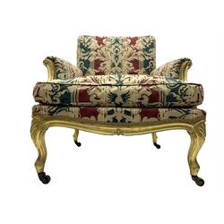 William Bertram & Son of London - pair late 19th century giltwood armchairs, moulded frame with scroll carved back and arm terminals, upholstered in striped fabric with foliate pattern, on shell carved cabriole supports, the brass castors stamped 