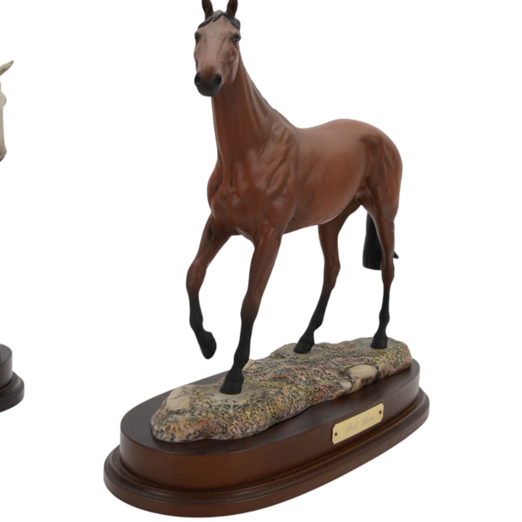 Two Royal Doulton horses, Desert Orchid and Red Rum, on wooden plinths 