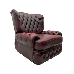 Traditional reclining armchair, upholstered in deeply buttoned oxblood leather