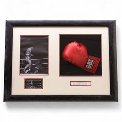 Framed display contained a single BBE Britannia boxing glove, signed by Sir Henry Cooper, ...
