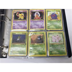 Collection of Pokemon trading cards, mostly 1999 Wizards Pokemon cards to include holo Charizard 4/102, first edition holo Machamp 8/102, further holographic cards; Dark Flareon 35/82 and Dark Vaporeon 45/82, cards from themed sets and 4th edition prints; 1998 Electronic Pokédex with cardboard boxes for themed decks Blackout, Overgrowth and Power Reserve Jungle, along with a large quantity of energy and trainer cards 