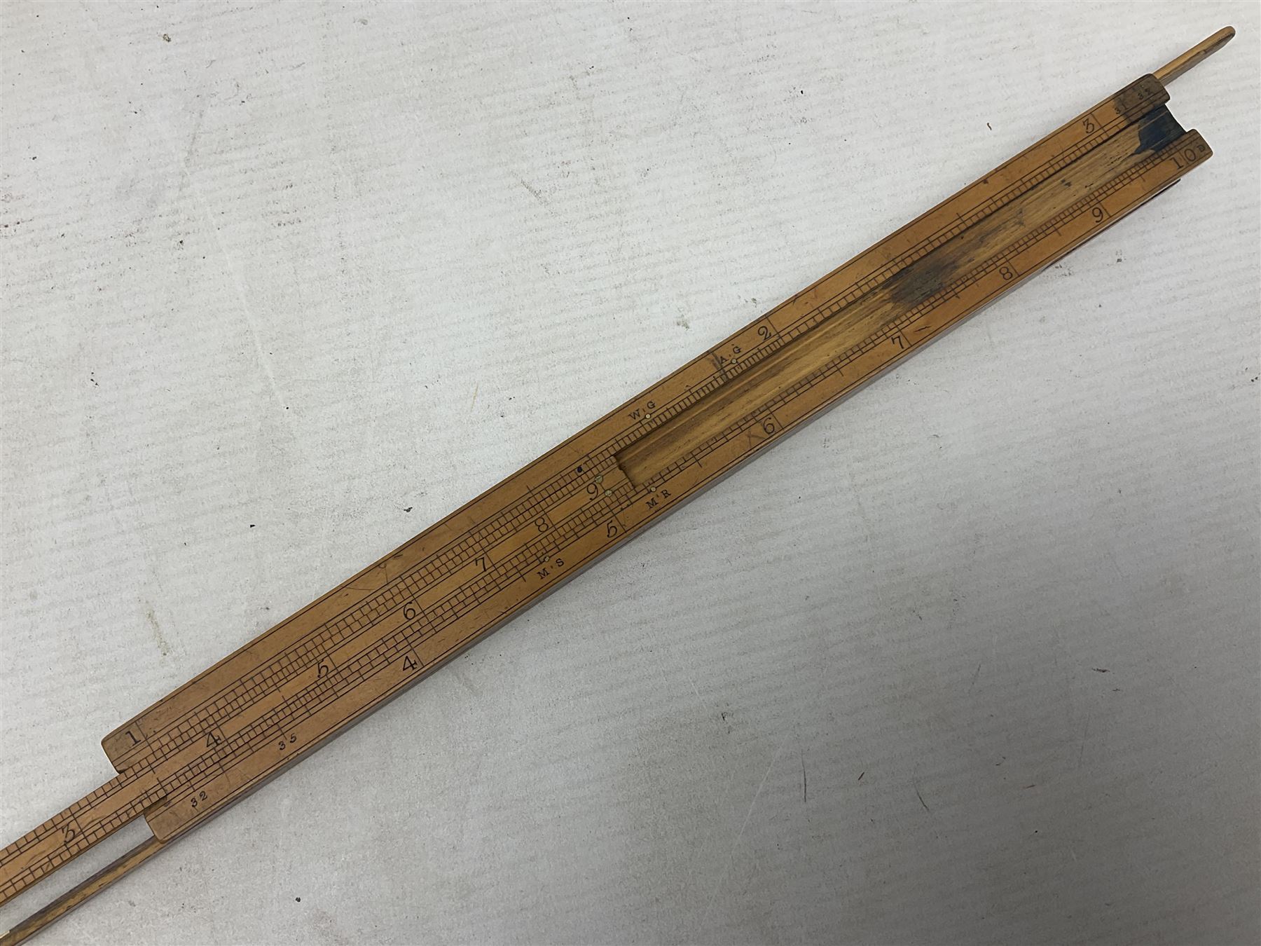 Late 18th/early 19th century boxwood ruler with four slides, for use by Customs &. Excise in the brewery trade; scales on all four sides each having a central slide with divisions on either side;  possibly made by 'E. Roberts, Dove Court, Old Jewry, London' (Edward Roberts (I) 1749-1776 & Edward Roberts (II) 1788-1795) L30.5cm