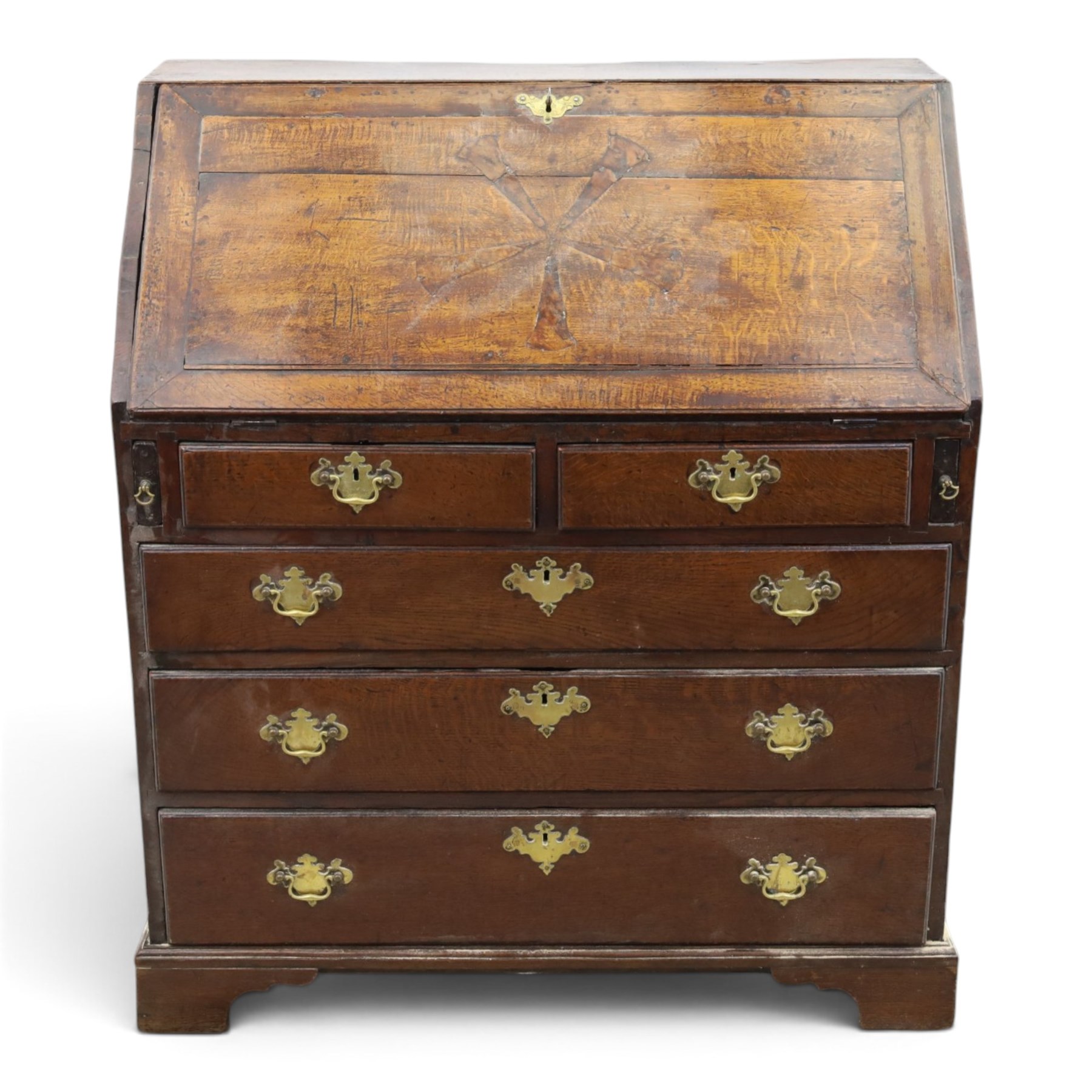 18th century inlaid oak bureau, the fall-front with central star inlay enclosing fitted interior with central cupboard flanked by fluted column correspondence drawers and pigeon holes, over two short and three long drawers, lower moulded edge on bracket feet