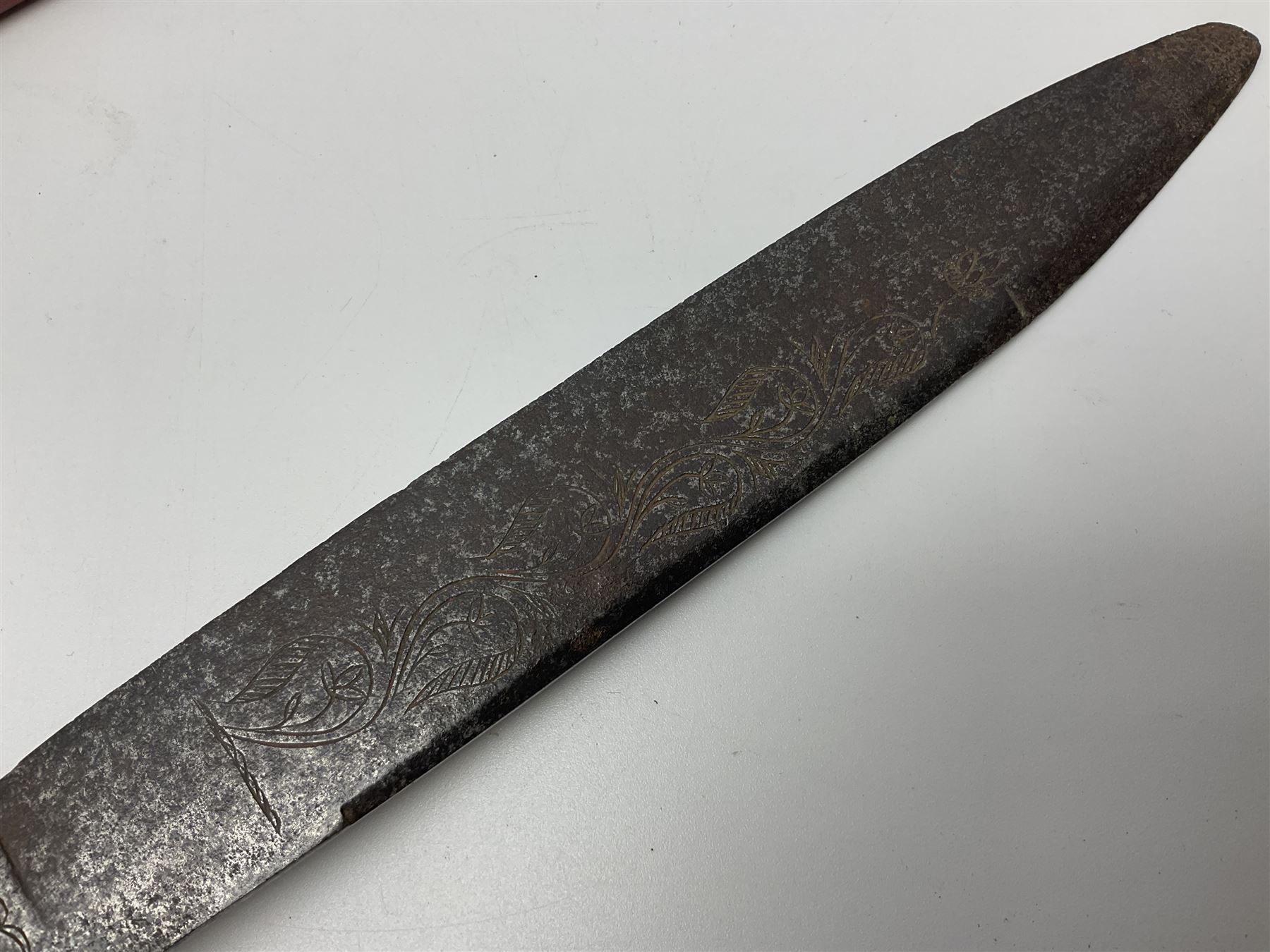 19th century continental folding knife with 15.5cm single edged blade, the pierced brass and iron handle with remains of horn grips L21.5cm overall closed; turned horn handled knife with foliate engraved blade; battlefield relic German 1884/98 knife bayonet; iron spear head; leather covered swagger stick; and two-piece gun cleaning rod