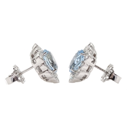 Pair of 18ct white gold oval aquamarine and diamond cluster stud earrings, hallmarked, total aquamarine weight approx 2.50 carat, total diamond weight approx 0.75 carat