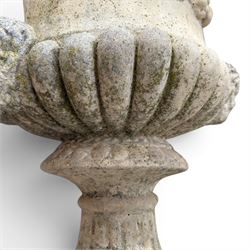 Pair of large cast stone garden urns, circular form with egg and dart border, tapering gadrooned bowl with cast handles and detail