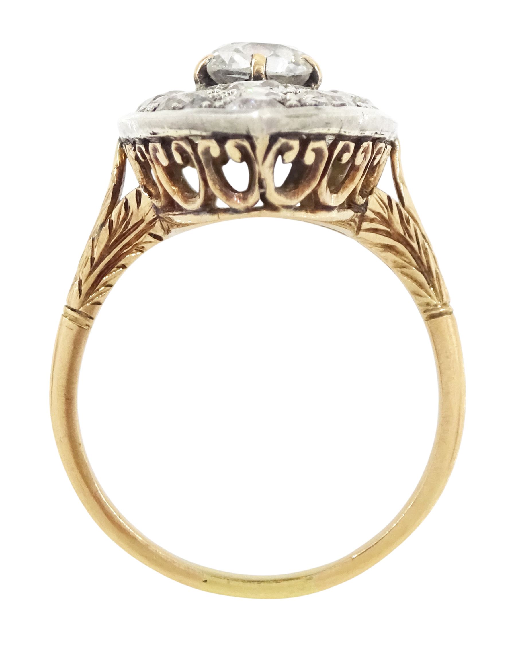 19th century 18ct gold and silver diamond marquise shaped cluster ring, the principal old cut cushion cut diamond of 1.15 carat, in a six claw setting, with pave set old cut diamond surround of 3.28 carat, pierced scroll design gallery and fleur-de-lis shoulders, French (Paris) import mark, total diamond weight 4.43 carat, with IGI report
