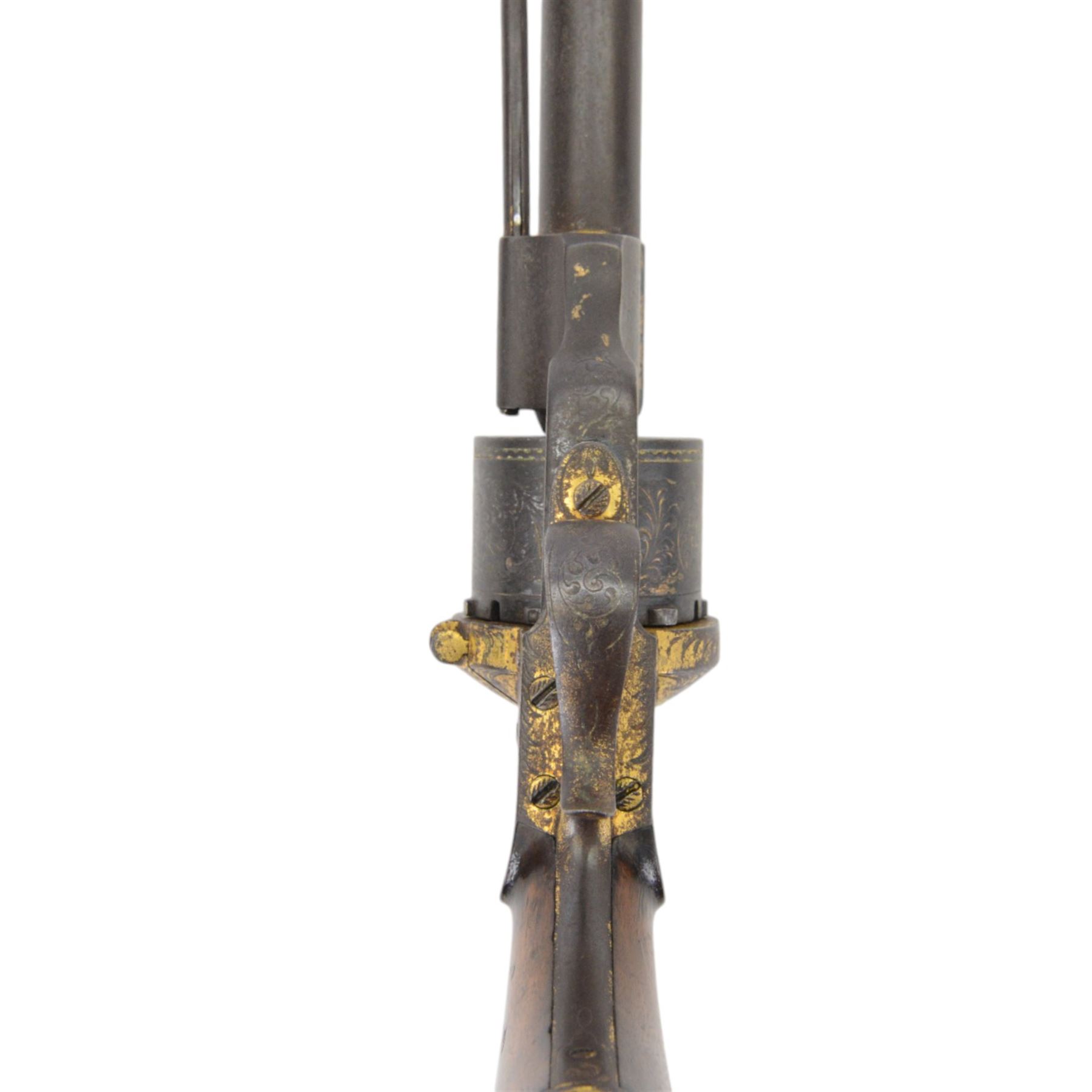French six shot percussion and pinfire revolver, round barrel 2cm, numbered 1 F 75344 beneath and Brevete Paris on the other side, cylinder and frame overlaid with gold vine leaves, tendrils and lines; with ejector rod on the right, plain wooden grip, and lanyard ring
Sold as an exempt item under Section 58 (2) of the 1968 Firearms Act, to be held as a curiosity or ornament