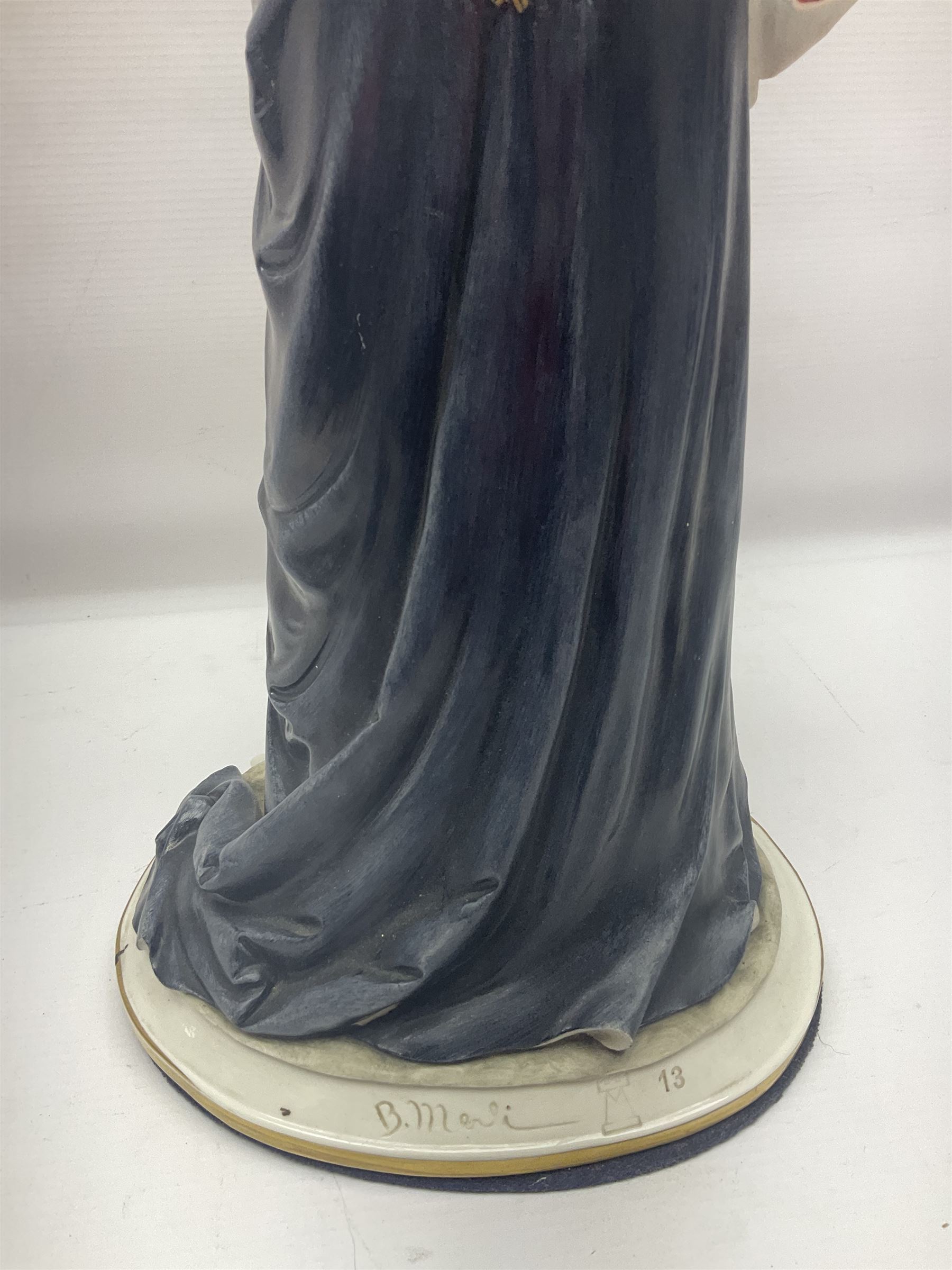 Capodimonte figure, modelled as HRH Queen Elizabeth II, with impressed mark to base, H38cm