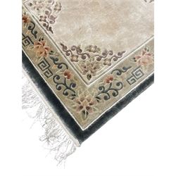 Chinese washed woollen camel ground rug, circular medallion surrounded by scrolls, the border decorated with birds and trailing floral decoration (248cm x 155cm); Chinese washed woollen pale green ground rug (125cm x 69cm); Persian design rug (186cm x 121cm) (3)