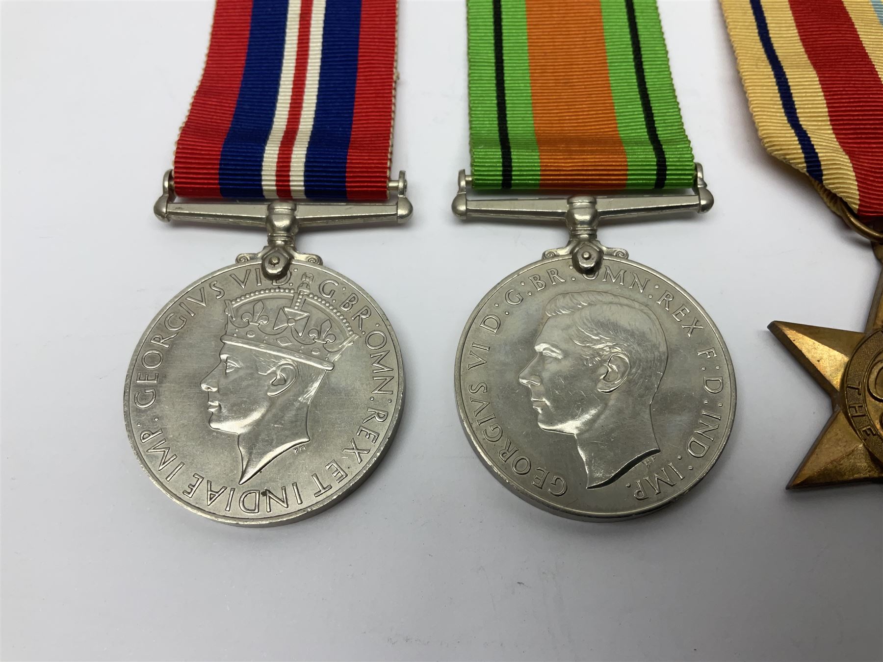 Group of five WWII medals comprising 1939-45 War Medal, Defence Medal and Italy, Africa and 1939-45 Stars; all with ribbons (5)