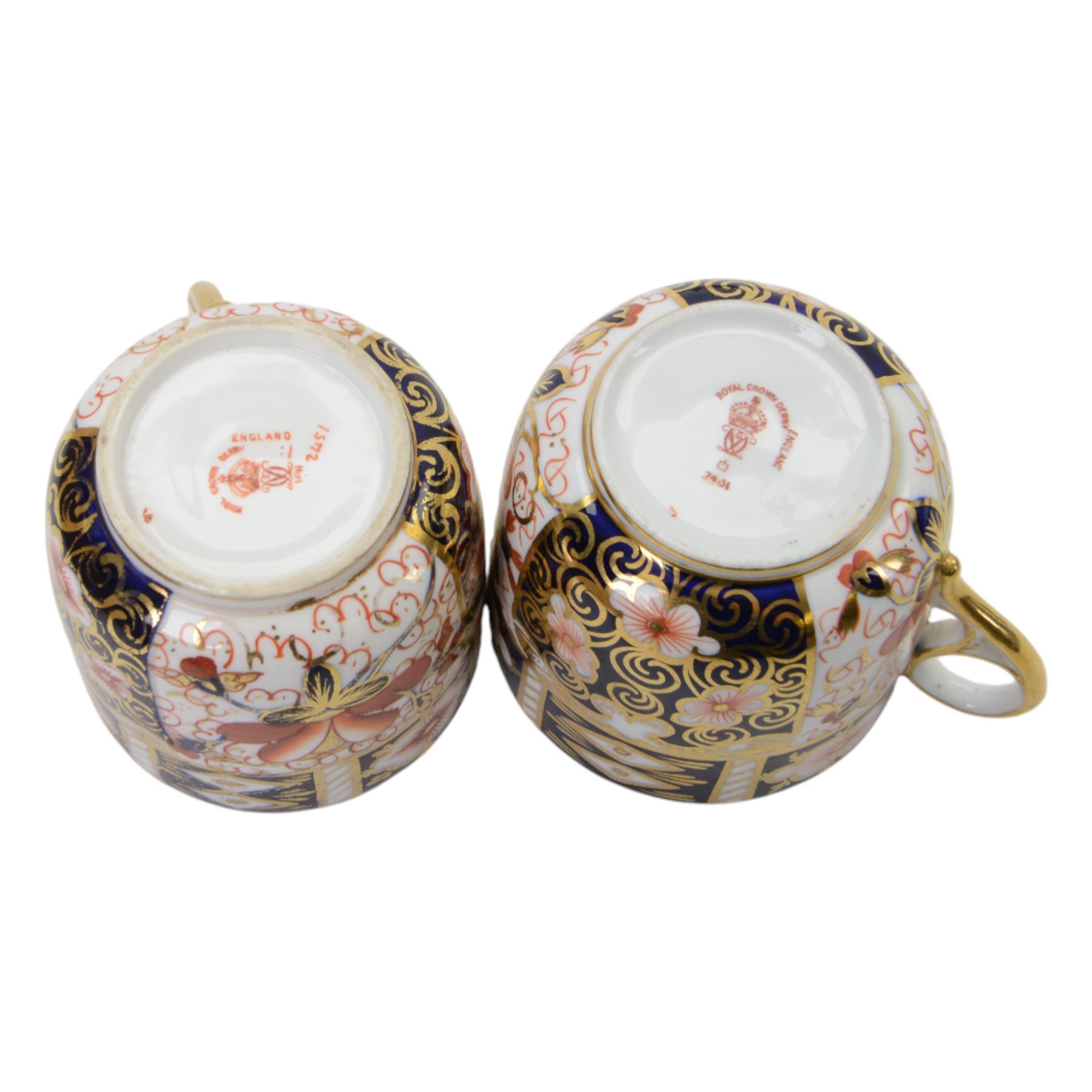 Royal Crown Derby imari pattern, miniature teapot and teacup, together with two cups and saucers and three plates