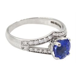 White gold sapphire and diamond ring, single oval cut sapphire of approx 1.00 carat, with split design diamond set shoulders, hallmarked 14ct