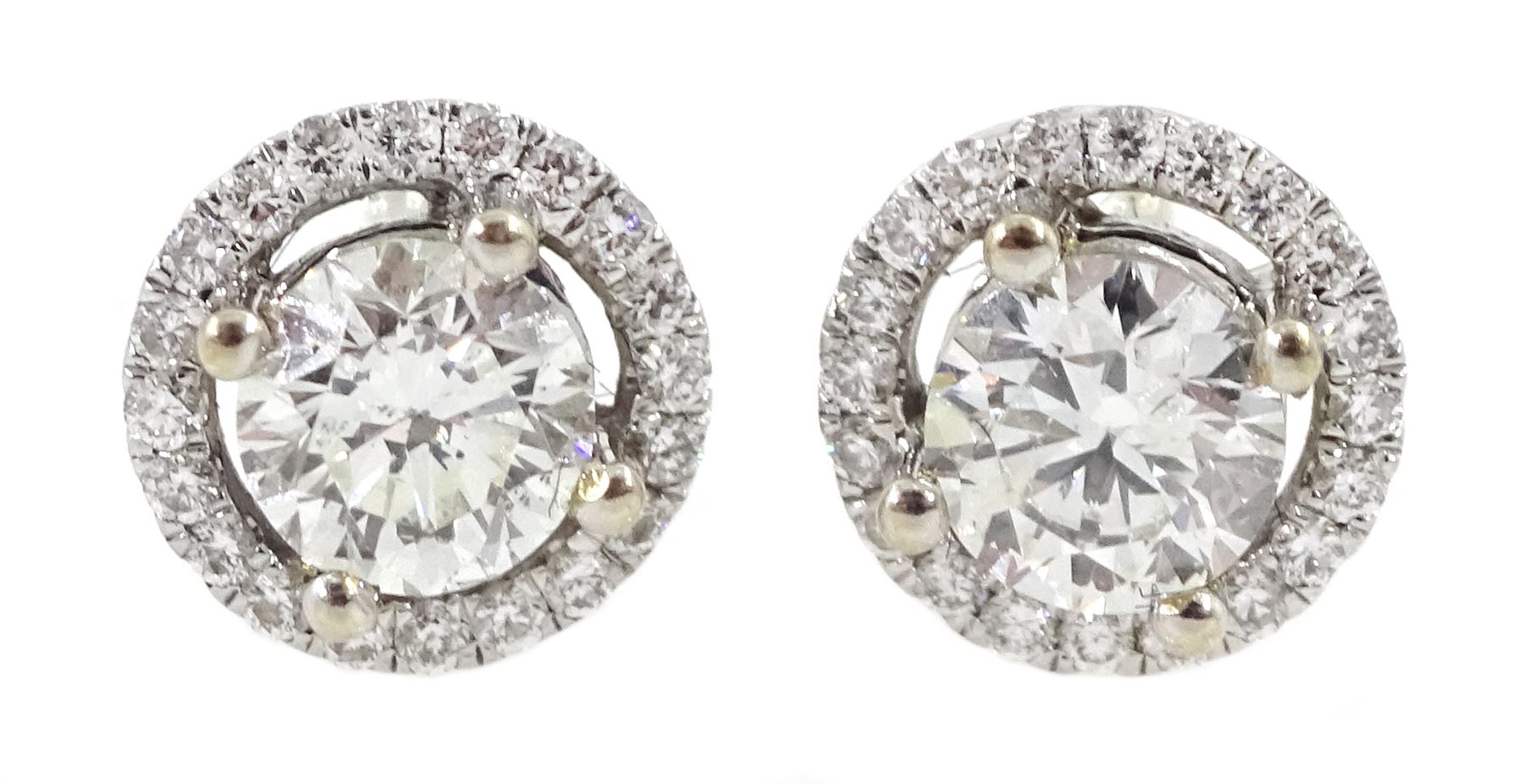 Pair of 18ct white gold round brilliant cut diamond halo stud earrings, total diamond weight approx 0.40 carat