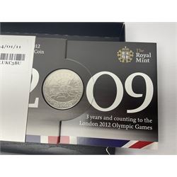 Mostly commemorative coinage, including various Queen Elizabeth II United Kingdom brilliant uncirculated fifty pence, two pound and five pound coins in card folders, The Royal Mint United Kingdom 2012 proof coin set, Alderney 2021 'Royal National Lifeboat Institution' five pound coin cover in Harrington and Byrne folder etc