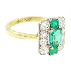 Early 20th century gold emerald and diamond panel ring, three octagonal cut emeralds, with four old cut diamonds set either side, stamped 18ct Plat, total diamond weight approx 0.85 carat