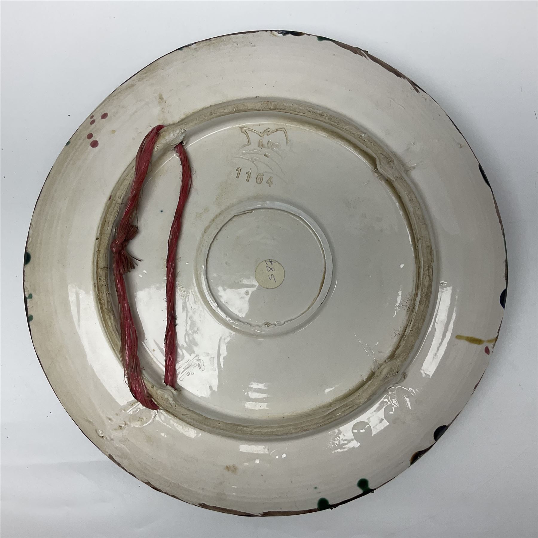 Two 20th Century Portuguese Palissy style Majolica wall plates, one depicting a crab, the other a lobster each to the centre modelled in relief surrounded by encrustations and shells, both with impress marks beneath, D34cm