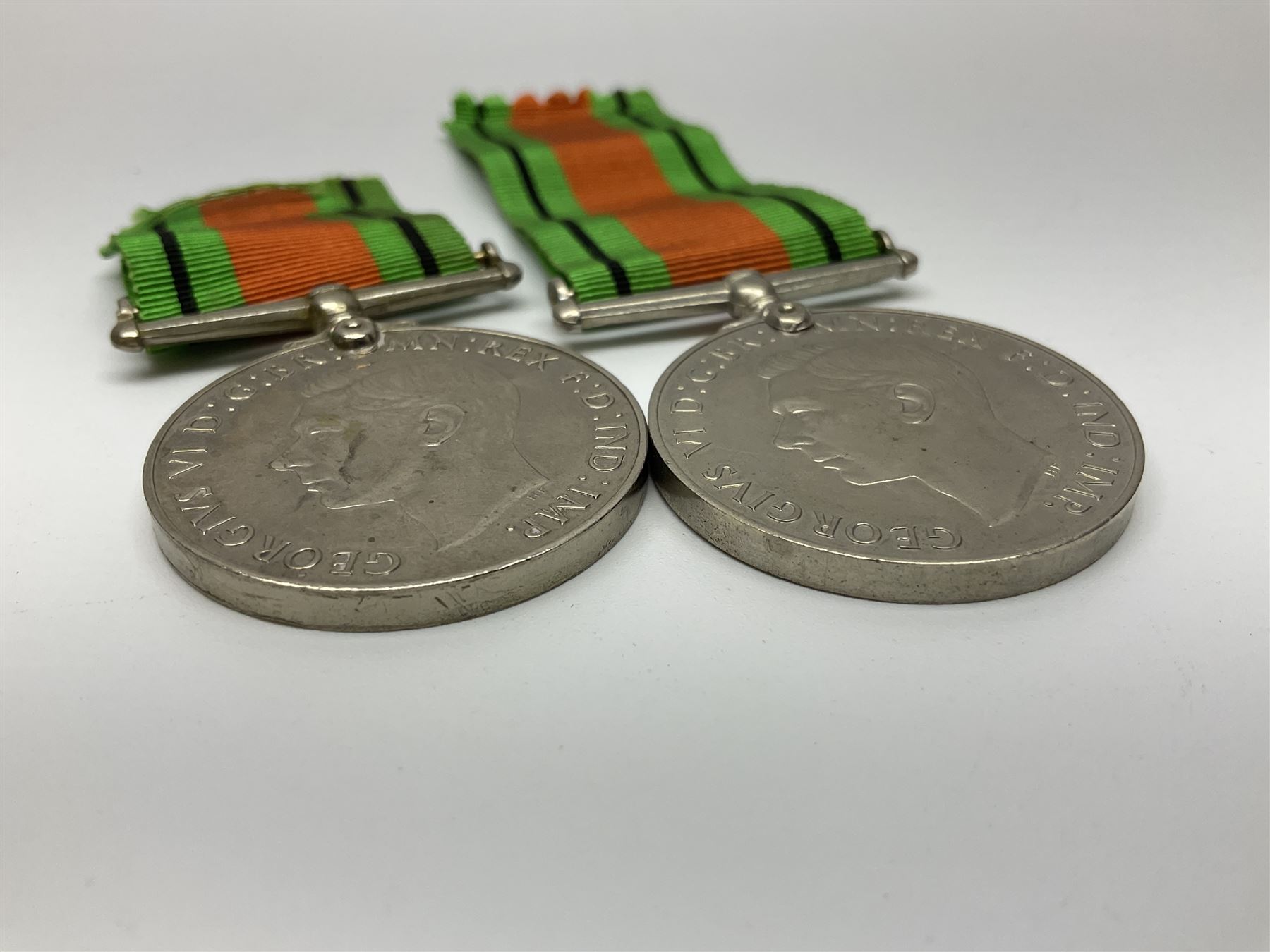 Ten WW2 medals comprising two 1939-1945 war medals, two Defence medals, two 1939-1945 Stars, two Africa Stars, France & Germany Star and Burma Star; together with bar of four miniature medals; all with ribbons