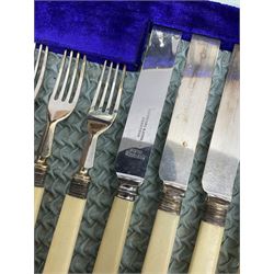 Silver plated dessert knives and forks with silver ferrules and mother of pearl handles, and other part canteen stainless steel cutlery with blue velvet lining in oak case