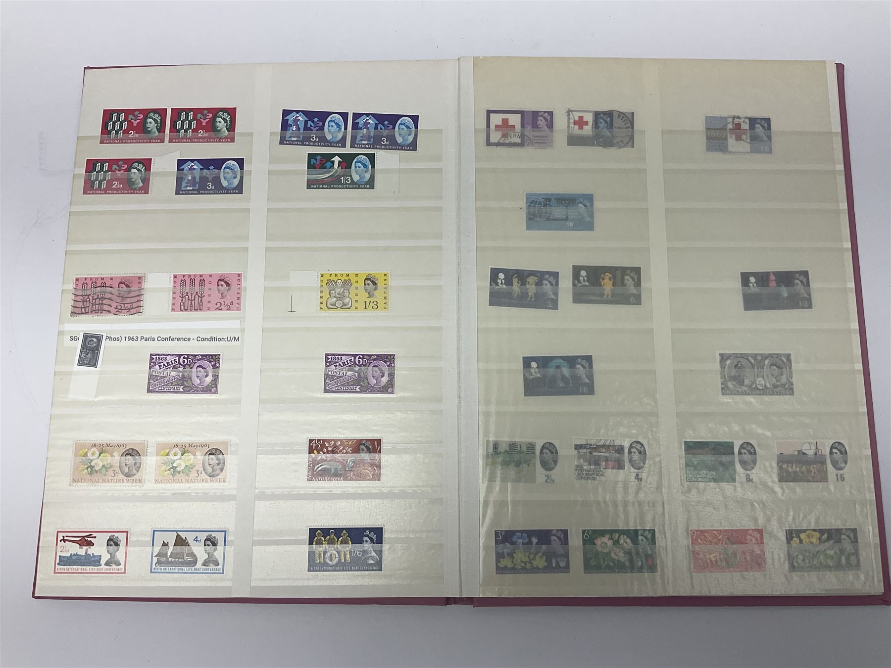 Mostly Great British stamps, including King Edward VII two shillings and sixpence, five shillings and ten shillings, King George V seahorses, King George VI high values, Queen Elizabeth II pre and post decimal etc, housed in a pink stockbook 