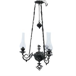 Late 19th century wrought metal hanging ceiling lamp, the ornate pierced central reservoir...