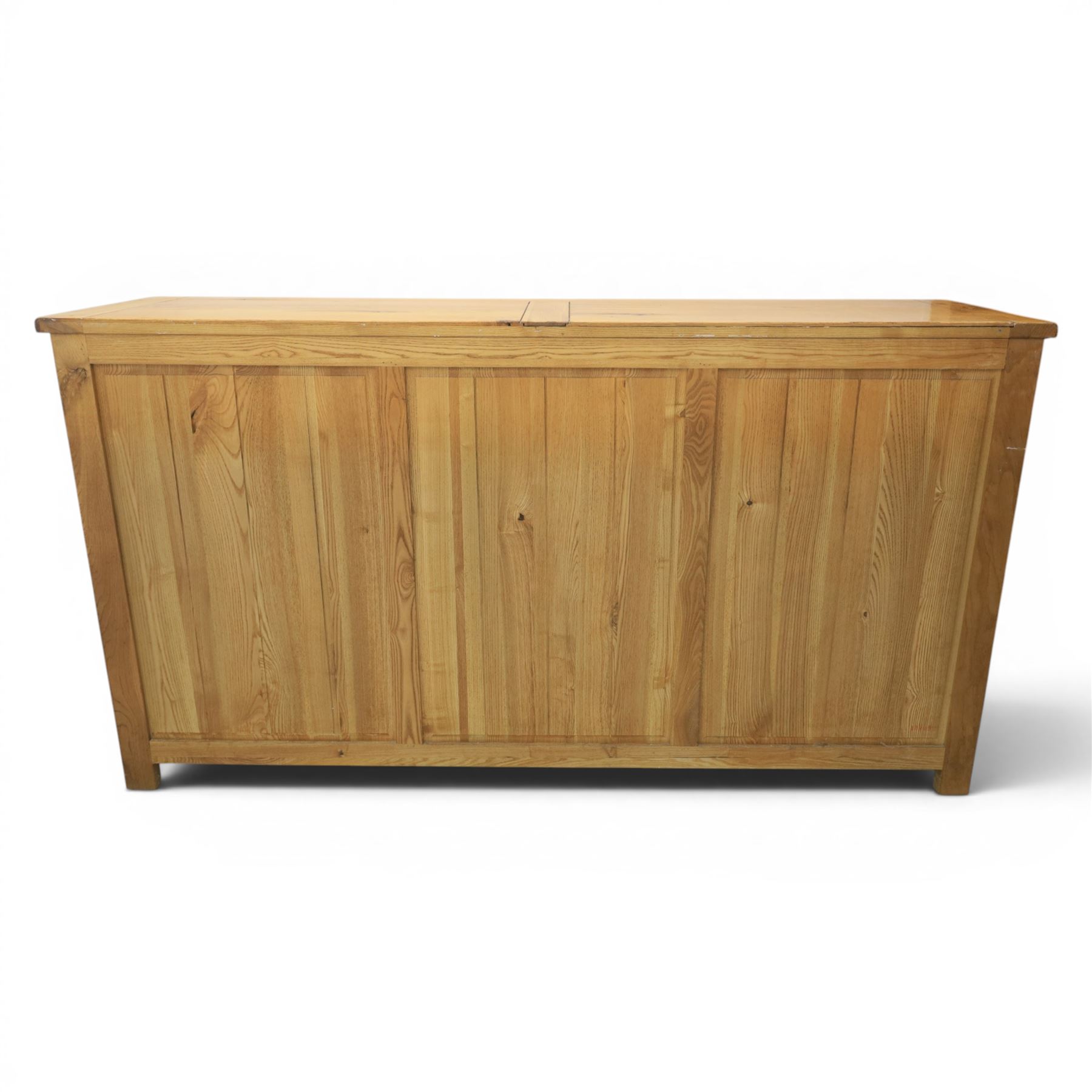Contemporary oak sideboard, with rectangular top above three drawers and three cupboard doors, blackened metal handles, raised on stile supports