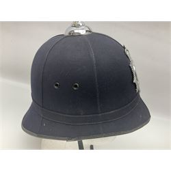 Police - Victorian turned hardwood truncheon with traces of decoration and VR cypher L42cm; Humberside Police helmet with Queens Crown helmet plate; hand lamp inscribed 'The Inspector'; and small pair of pewter figures of police officers (5)